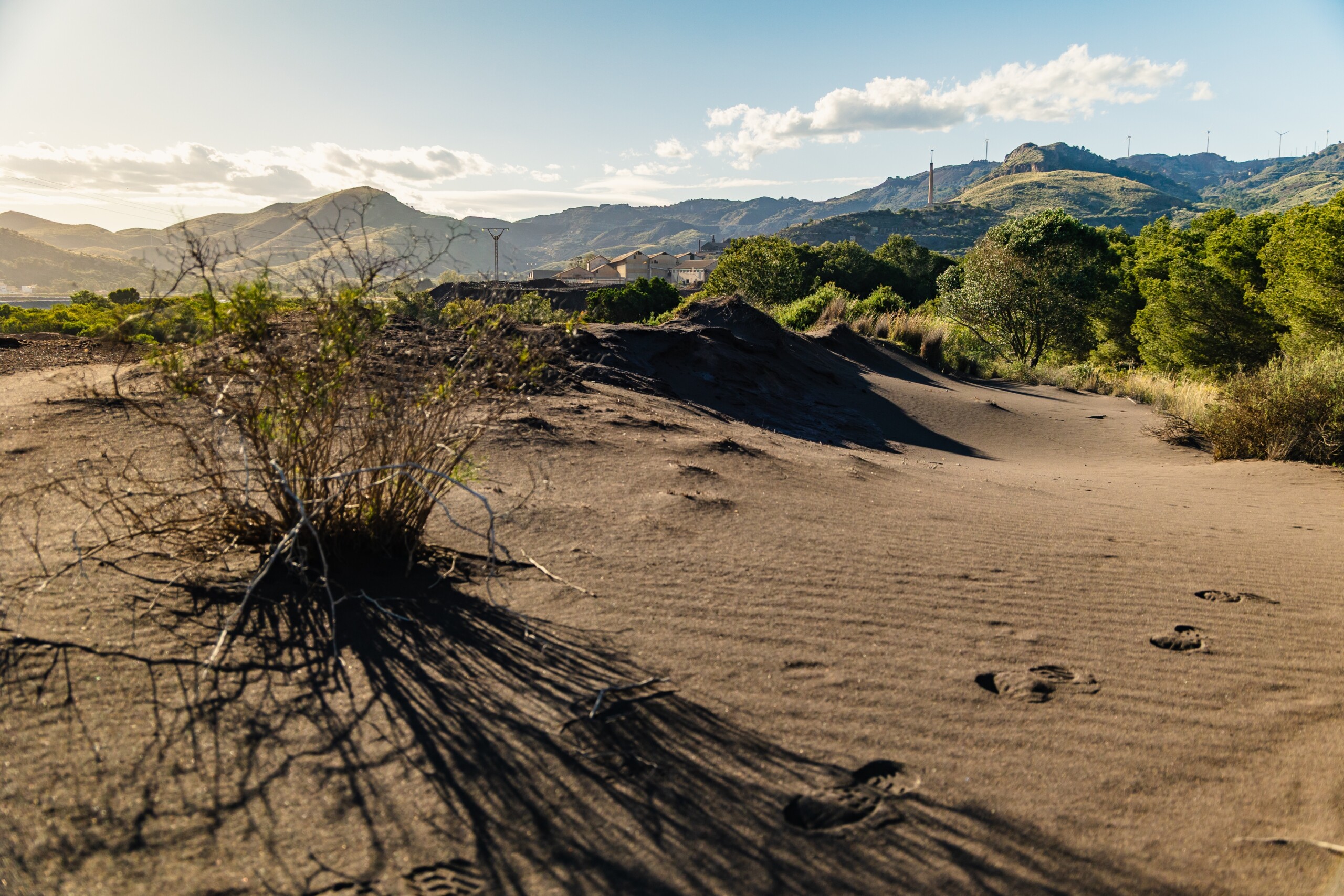 Footprints,In,Polluted,Sand,Leading,To,Abandoned,Mining,Site,In
